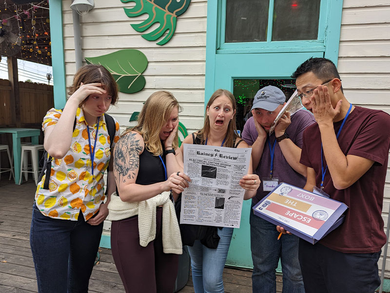 silly photo of friends pretending to read a newspaper